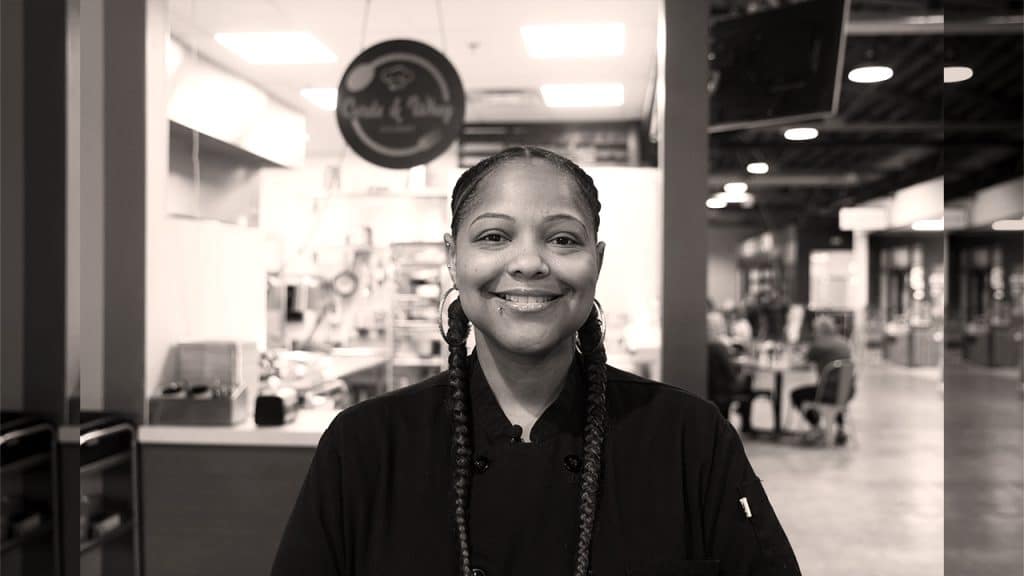 TEDC_BorrowerMainImages_010524_CurdsWhey Chef/Owner of Curds and Whey, Faith Walker, smiling in restaurant